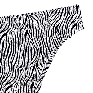 Vista detallada de tela con estampado de cebra sin costuras y costuras de alta calidad