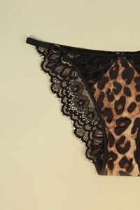 Close-up of leopard print fabric and intricate black eyelash lace detailing on panties