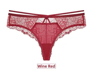 Detailed close-up of wine red lace thong featuring elegant floral patterns and strappy waist