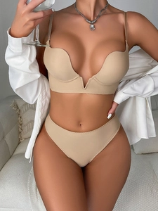 Detail of skin-toned seamless bra set with deep V-neck and supportive push-up cups