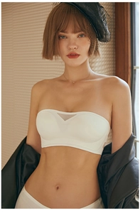 Detail of ivory strapless bra featuring V-mesh breathable layer and wavy anti-slip edges