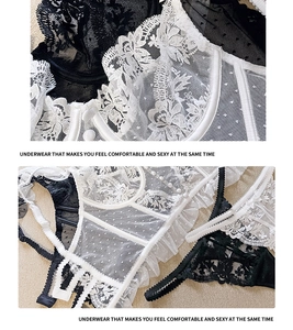 Detail van Franse kanten lingerieset met bloemenborduursel en mesh met stippenpatroon