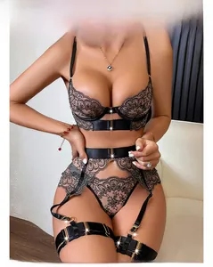 Detail of black eyelash lace lingerie set featuring sheer mesh and intricate metal buckles