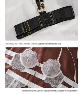 Detail of white eyelash lace lingerie set featuring delicate floral patterns and gold clips