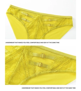 Détail de culotte en dentelle jaune citron avec boucles dorées réglables et maille fine