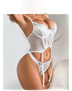 Detail showing white floral embroidery lace corset with matching leg ring garters