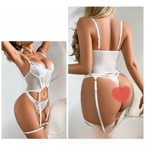 Detail view of white floral lace lingerie set with suspender belt and matching thong