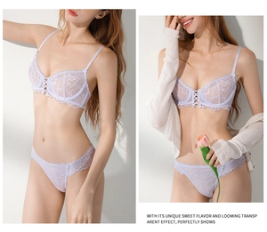 Detail of lavender lace lingerie set showing embroidery texture and front cross-strap design