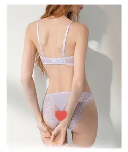 Rear view of lavender lace lingerie set showing sheer floral embroidery and straps