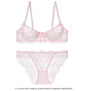 Detail of pink floral lace lingerie set featuring adjustable straps and bow decoration
