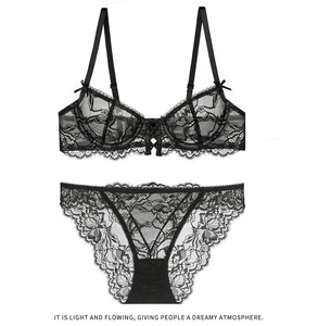 Detail view of black lace lingerie set featuring sheer embroidery and wave lace trim