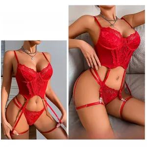 Macro detail of red floral lace embroidery on the sheer corset with steel ring support