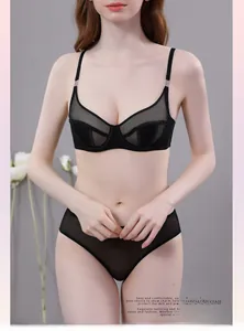 Detail of black sheer mesh lace bra set with underwire cups and elegant metal hardware