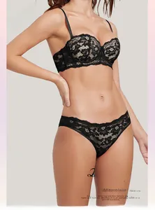 Detail of black floral lace bra and matching panties with delicate embroidery set