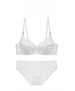 Detailed view of white sheer mesh lingerie set featuring thin straps and supportive cups
