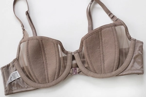 Detail of front closure on coffee brown bra with vertical stripes and mesh panels