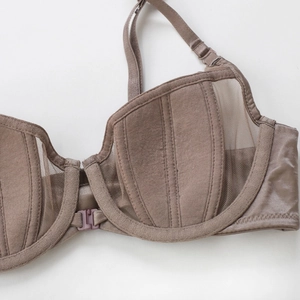 Front-closure mocha brown bra with vertical stripe texture and sheer mesh side panels