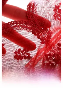 Macro detail of red lace bra featuring 3D molded cups and delicate floral embroidery work