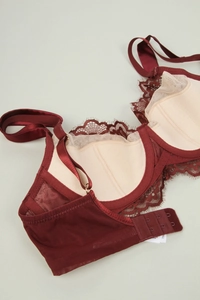 Detail view of the fine eyelash lace fabric and soft underwire on this dark red bra