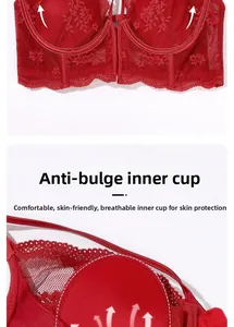 Detail of red lace bra featuring functional rabbit-ear inner cups for nipple coverage