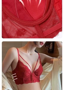 Detail of red floral lace bra with front buckle closure and dual shoulder straps