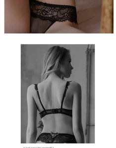 Detail of black lace lingerie set featuring strappy panties and intricate floral patterns