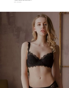 Close-up of delicate black floral lace embroidery on french style unlined bra cups