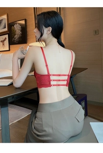 Detail of red floral lace bra featuring minimalist straps and stylish triple back buckle