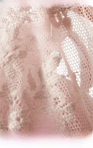 Close-up of pink floral lace fabric with high-density 48S knitting for soft texture