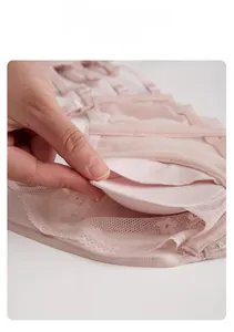 Detail of removable pad insert for light lace bra showing breathable mesh inner lining