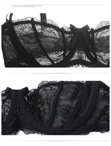 Detail of black semi-cup lace bra showing breathable mesh lining and floral patterns