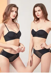 Detail of black non-slip strapless bra set showing two-way wear and sheer mesh panty
