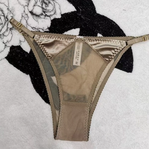 Detail of velvet mesh panties with adjustable gold side straps and M size wash label