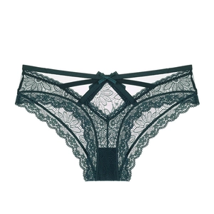 Detail of dark green lace panties with floral embroidery and small bow decoration