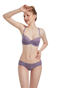 Close-up of purple sheer floral lace lingerie set featuring delicate embroidery and bows