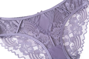 Detail of purple floral lace panties with scalloped edges and breathable fabric