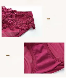 Detail view of dark red lace panties with delicate floral embroidery and ribbon bow