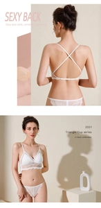 Dettaglio delle spalline incrociate sulla schiena di un set di lingerie in pizzo bianco
