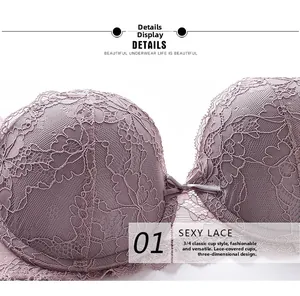 Close-up detail of mauve lace bra featuring floral embroidery and center bow detail