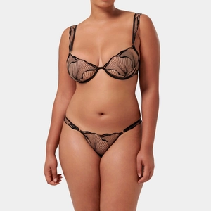 Detail of sheer mesh black embroidery lingerie set with delicate wavy pattern and lace