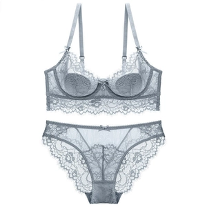 Elegant grey lace lingerie set with floral mesh bra and matching sheer panties on white background