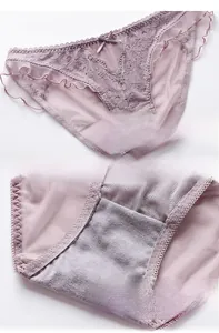Detail of lavender lace panties with cotton crotch and delicate bow decoration