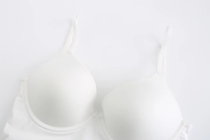 Detail view of white seamless bra with soft underwire and smooth fabric texture