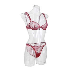 Detailed view of dark red sheer lace bra and thong set with delicate wavy textures