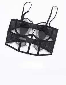 Detail of black eyelash lace bustier featuring elegant double-strap and crisscross back design