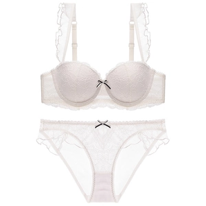 Elegant white lace lingerie set with ruffled straps and floral embroidery details