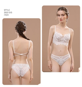 Detailed view of white eyelash lace bra set with backless design and sheer mesh paneling