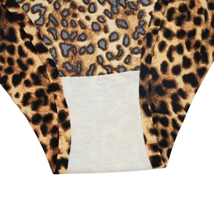 Detailed close-up of leopard print panties with soft white cotton lining for comfort