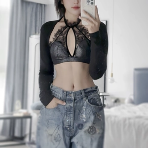Close-up of black lace halter top with long sleeves and delicate embroidery detail