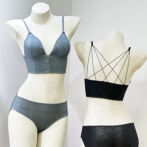 Detailed back view showing criss-cross straps and front zipper of the wireless bralette